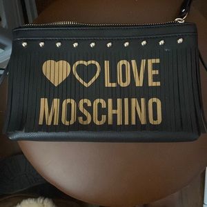 Beautiful Black & Gold wristlet by Love Moschino